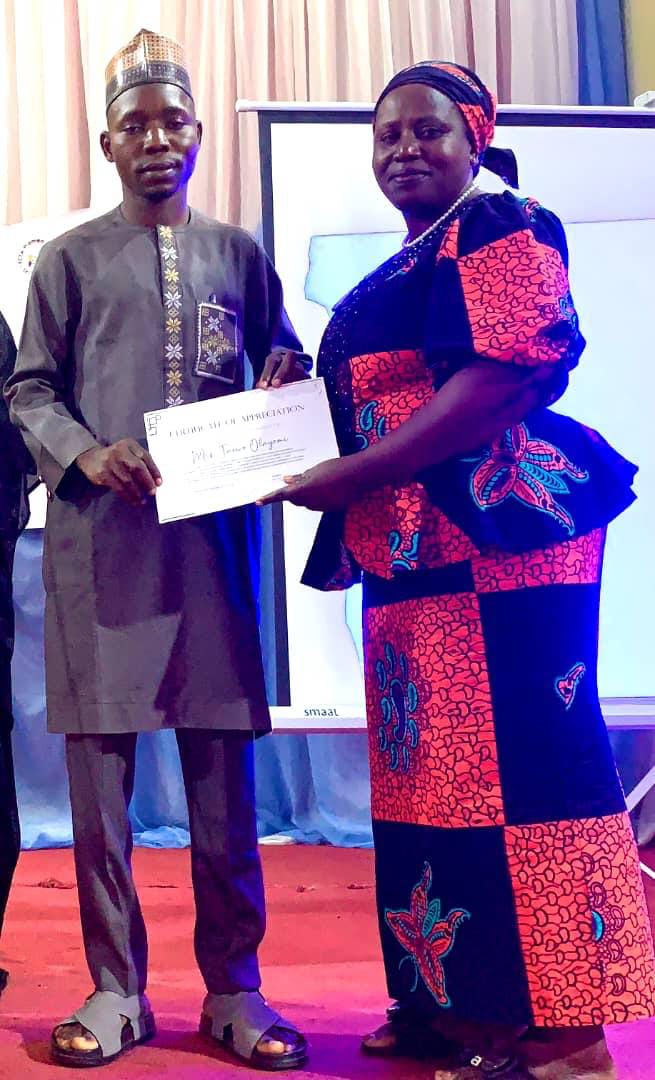 CEO receiving certificate for Birth Attendants Empowerment Program
